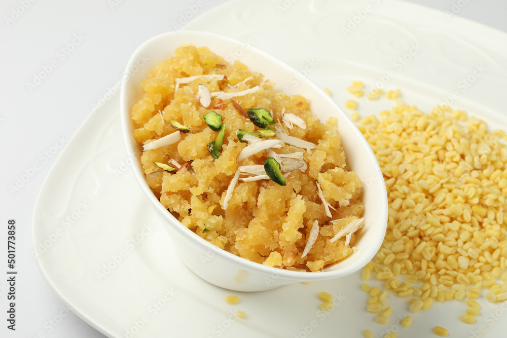 Moong dal halwa is a classic Indian sweet dish made with moong lentils, sugar, ghee and cardamom powder Moong dal halwa is a classic Indian sweet dish made with moong lentils, sugar, ghee and cardamom powder