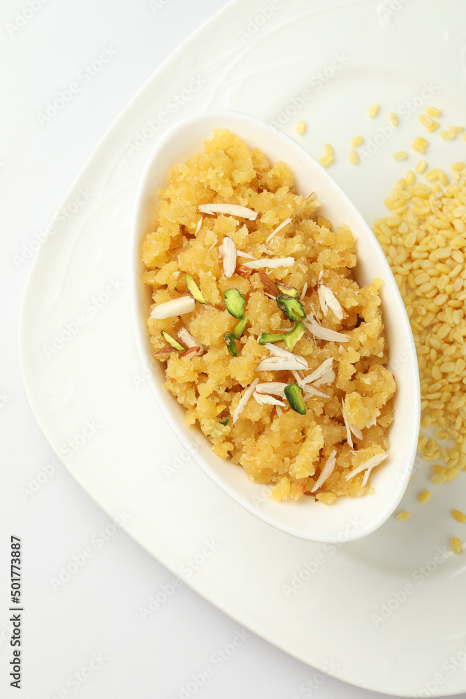Moong dal halwa is a classic Indian sweet dish made with moong lentils, sugar, ghee and cardamom powder Moong dal halwa is a classic Indian sweet dish made with moong lentils, sugar, ghee and cardamom powder