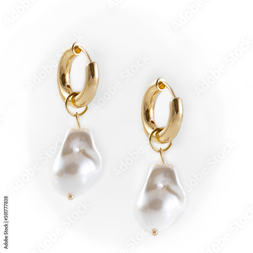 Baroque Pearl Drop Earrings dangling on white