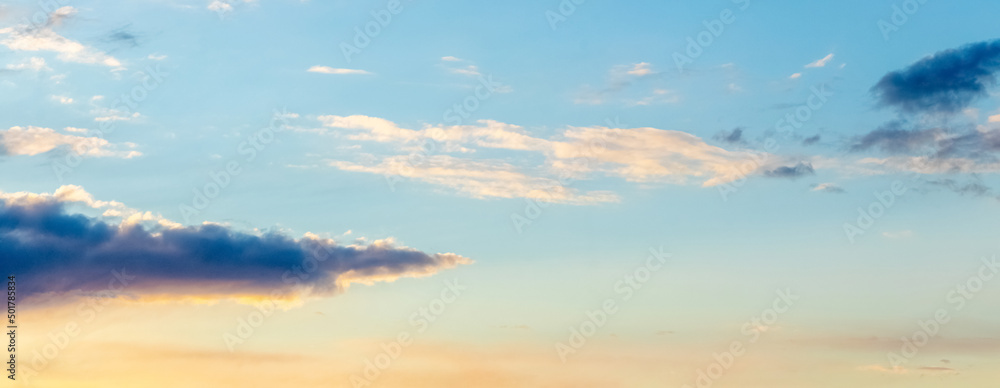 Picturesque sky with fluffy clouds at sunset, panorama