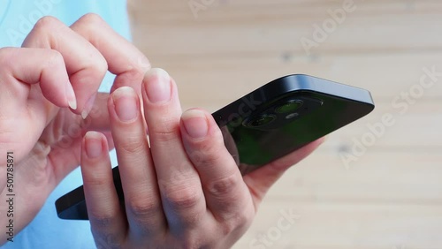 female hands use iPhone 12