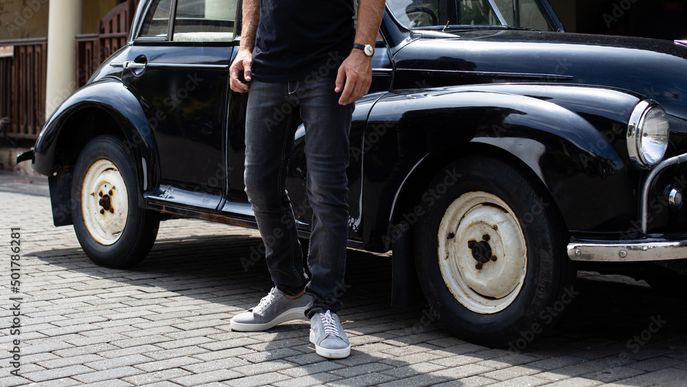 Black denim jeans on a model, close-up, a fashion advertising photo for a banner or catalog, new collection.
