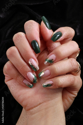 Feminine decorated nails with green colors