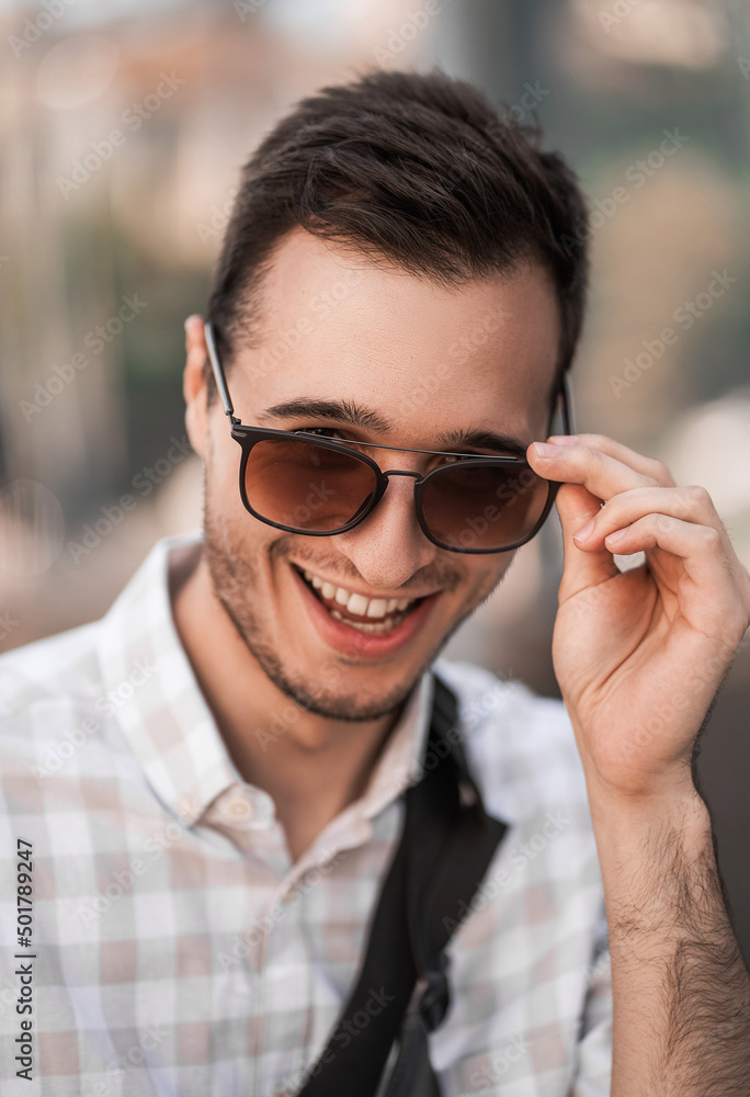 focus on details. portrait of a young handsome man in sunglasses focus on details. portrait of a young handsome man in sunglasses