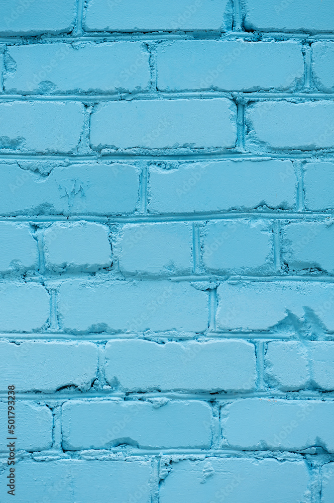 The texture of a brick wall painted in blue. vertical photo The texture of a brick wall painted in blue. vertical photo