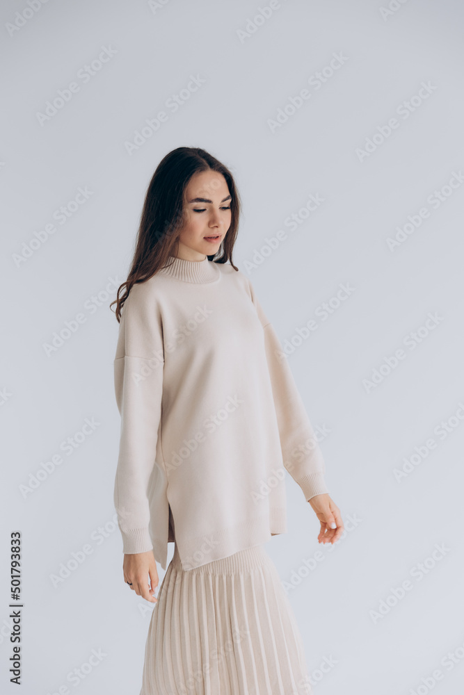29.04.22 Kyiv, Ukraine: stylish portrait of a young woman posing for a photo on a white background studio cyclora with natural daylight from the window 29.04.22 Kyiv, Ukraine: stylish portrait of a young woman posing for a photo on a white background studio cyclora with natural daylight from the window