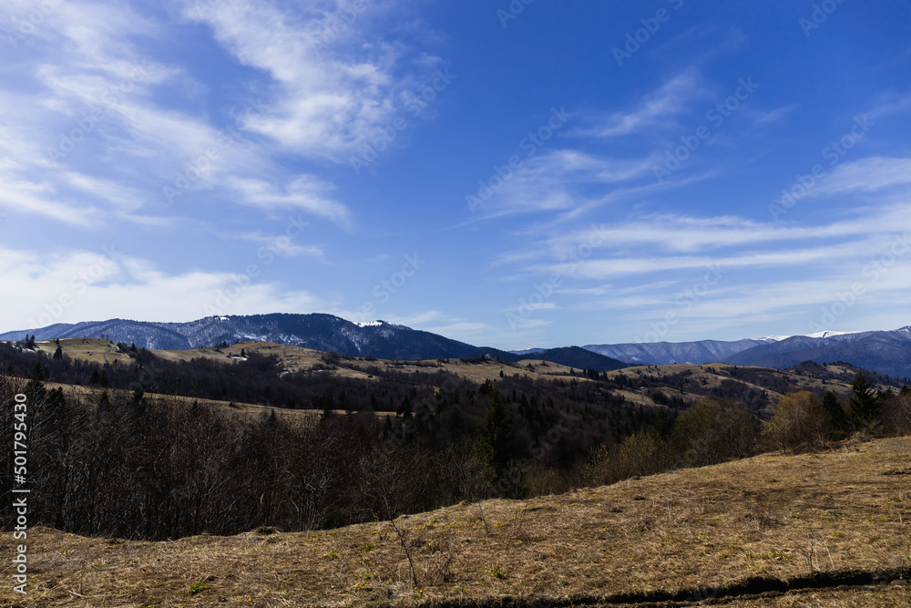 Scenic view of mountains and blue sky at background.
