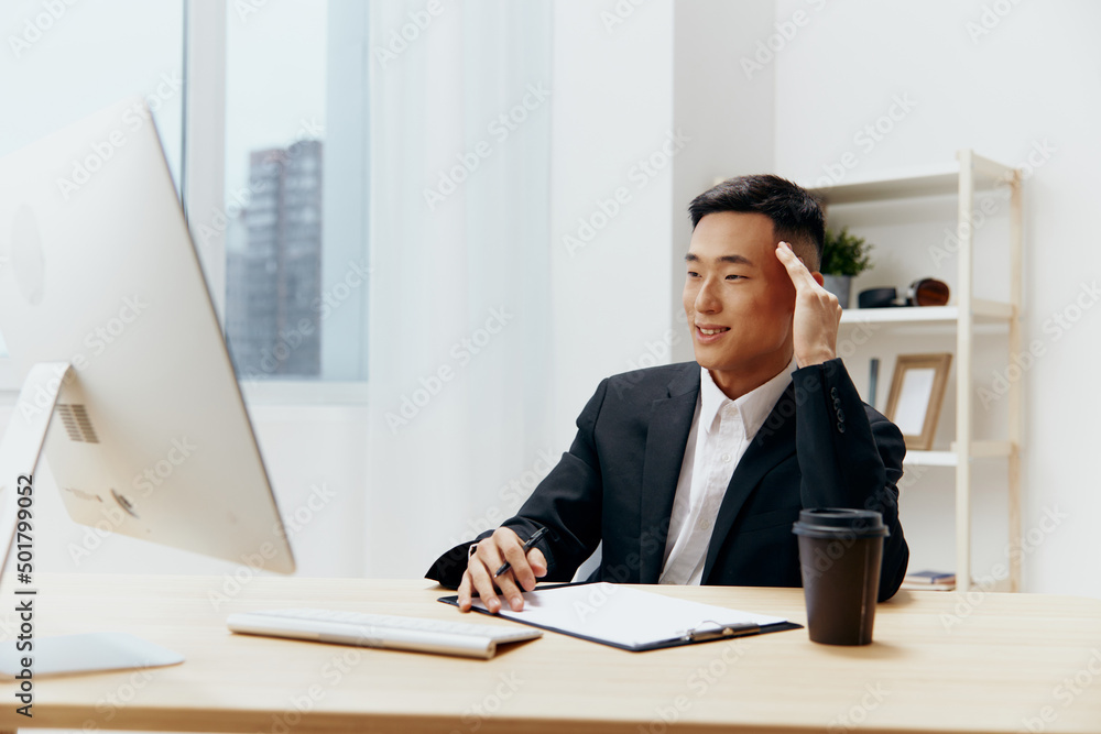 Fototapeta premium businessmen sitting at a desk in front of a computer emotions technologies