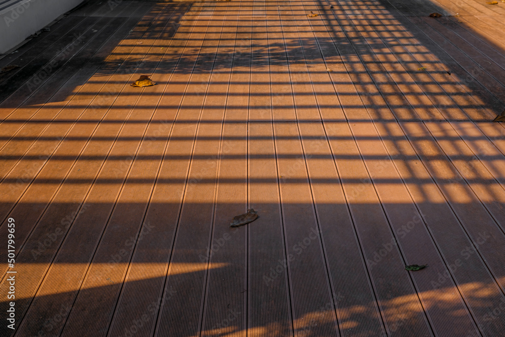 Fototapeta premium wooden floor planks on a bright sunny day