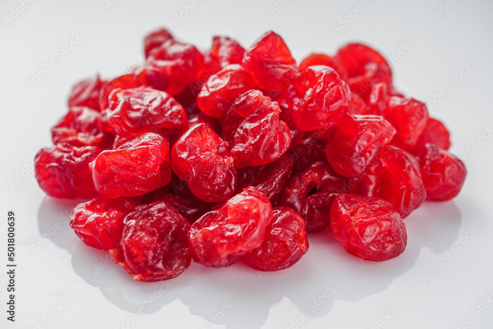 dried cherry berry on a white acrylic background dried cherry berry on a white acrylic background
