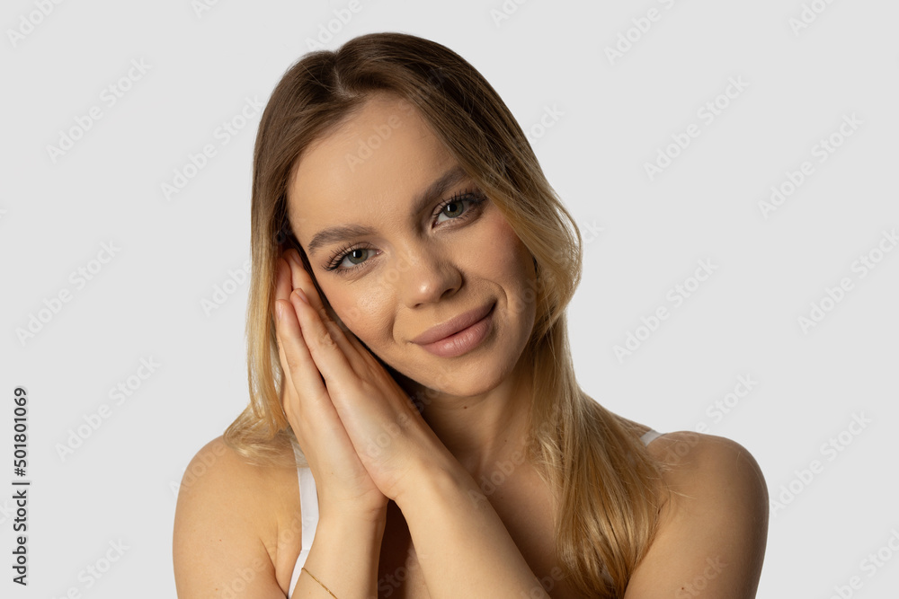 Fototapeta premium face of beautiful cute young caucasian female on white background