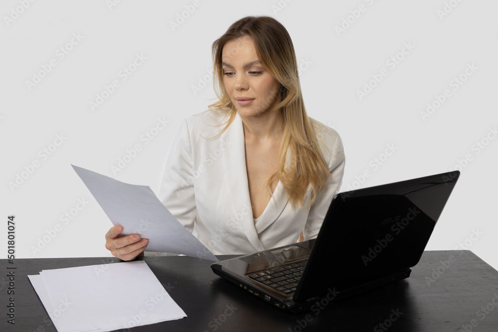 attractive businesswoman in white jacket with laptop
attractive businesswoman in white jacket with laptop