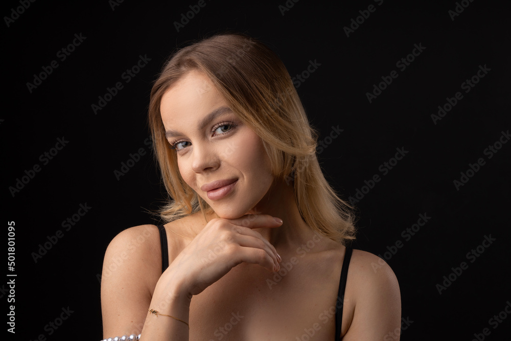 portrait on black background of young beautiful woman with makeup portrait on black background of young beautiful woman with makeup