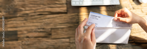 Obraz na plátně Businessperson Opening Envelope With Paycheck