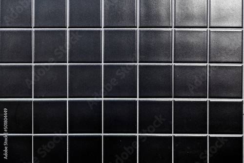 Fragment of glazed ceramic tiled wall