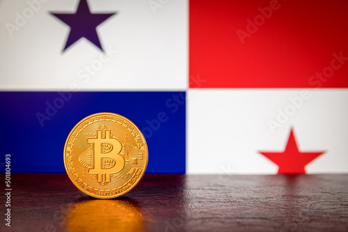 Bitcoin physical golden coin with Panama flag in the background