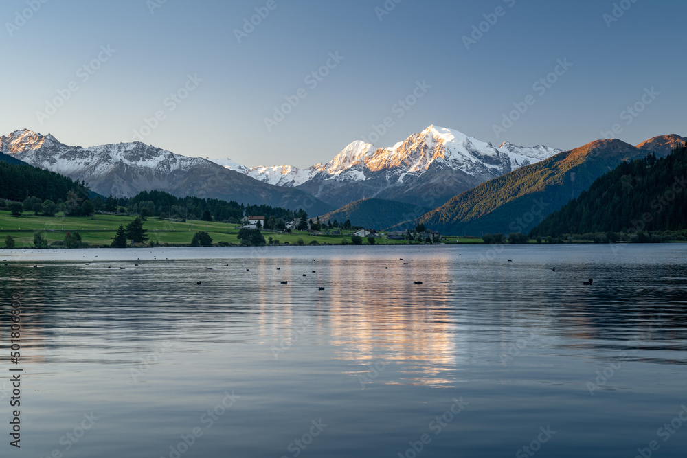 Mountain landscape in the morning light, Ortler reflected in Haidersee, Reschenpass, South Tyrol, Italy, Europe Mountain landscape in the morning light, Ortler reflected in Haidersee, Reschenpass, South Tyrol, Italy, Europe