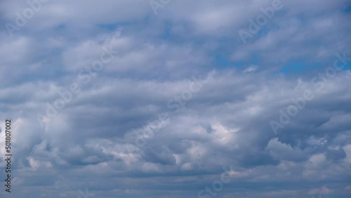 Cumulus clouds move in the blue sky, Timelapse. Cirrus layers of clouds change the shape of cloud space. Majestic Amazing Sky. Dramatic cloudscape time lapse. Change of weather. Nature weather. 4K