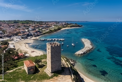 Aerial view of byzantine tower and beach of village Nea Fokea in Chalkidiki Greece