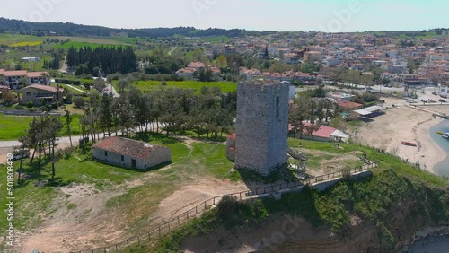 Aerial view of  byzantine tower and beach of village Nea Fokea in Chalkidiki Greece photo