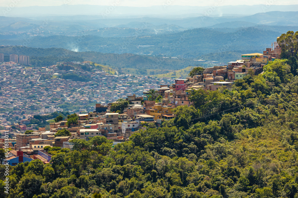 View of the favela Aglomerado da Serra in the foreground and the rest of the city of Belo Horizonte in the background.