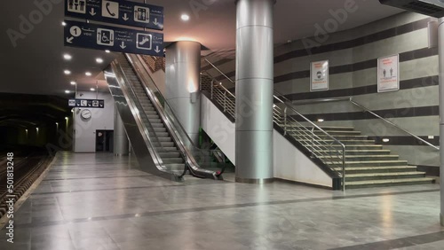 Empty escalator inside a railway station photo
