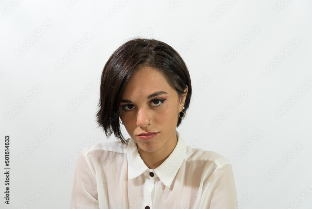 serious young woman staring, mysterious, white background serious young woman staring, mysterious, white background
