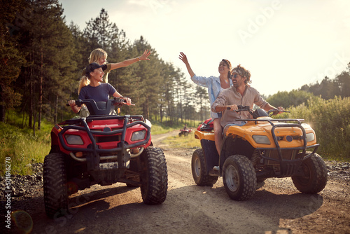 Group of traveler friends driving quads