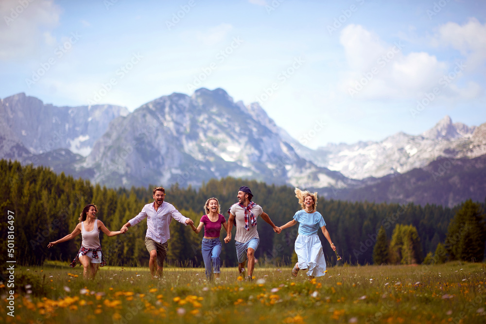 A group of friends having a good time in the nature. Friendship, nature, activity