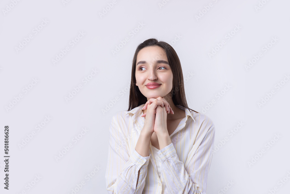 Portrait of a beautiful young woman thinking, isolated on white background Portrait of a beautiful young woman thinking, isolated on white background