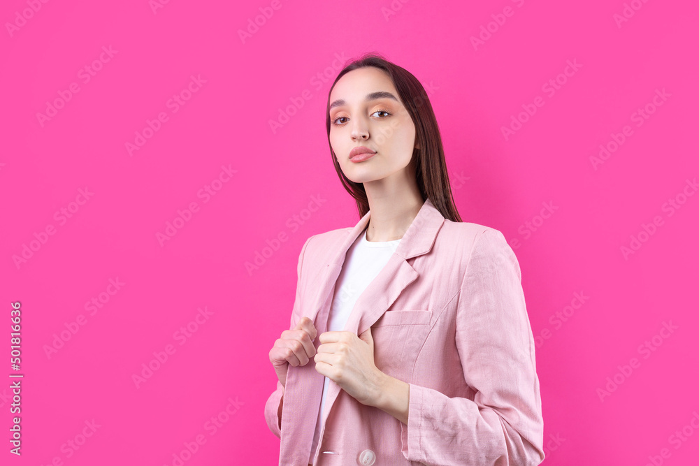 Portrait of beautiful young woman in pink jacket thinking isolated on red background Portrait of beautiful young woman in pink jacket thinking isolated on red background
