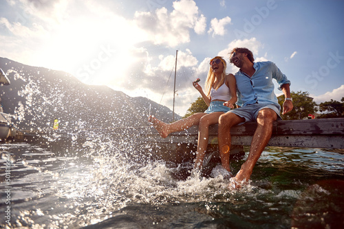 Canvastavla happy man and woman enjoying together at holiday