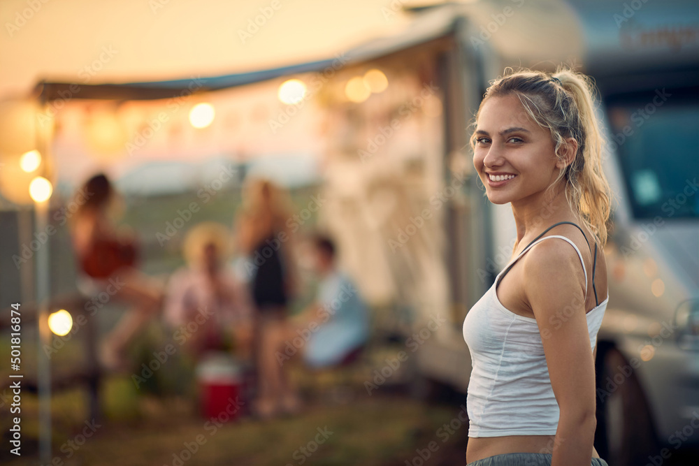 Girl in front of camper van.Travel and friendship celebration concept