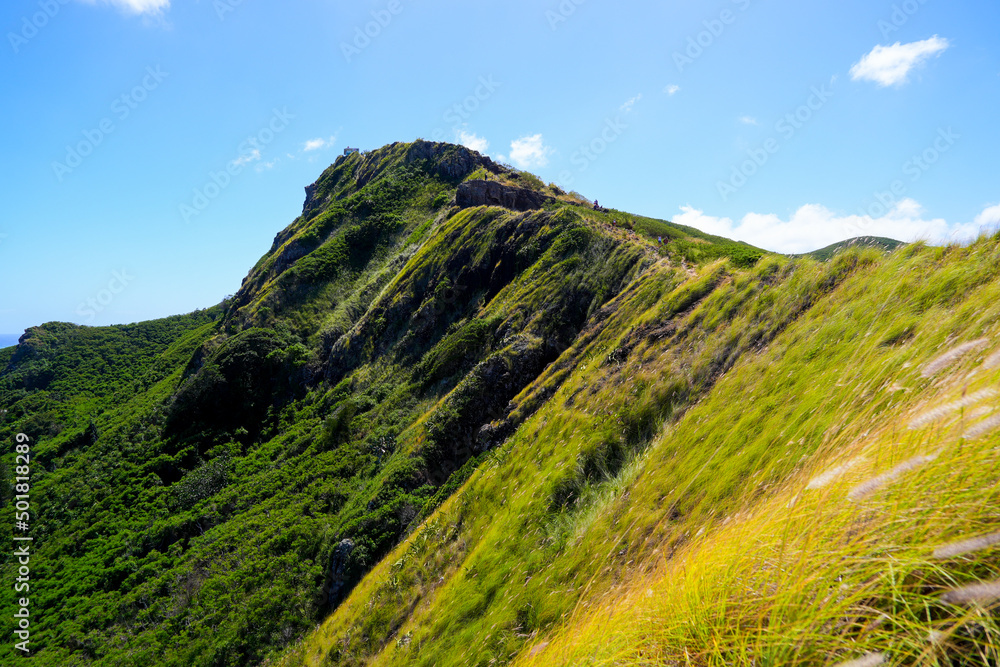 Green mountain ridge over Lanikai Beach in Kailua, on the eastern side of Oahu in Hawaii, United States