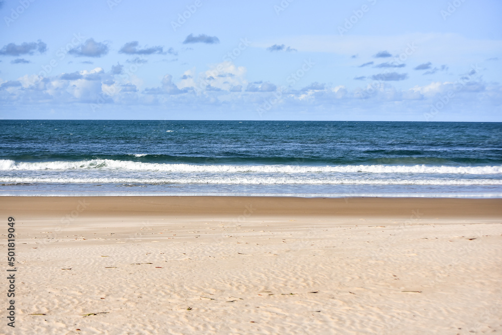 beach and sea in the morning, sea ​​with calm waves, sea with small waves, horizon line