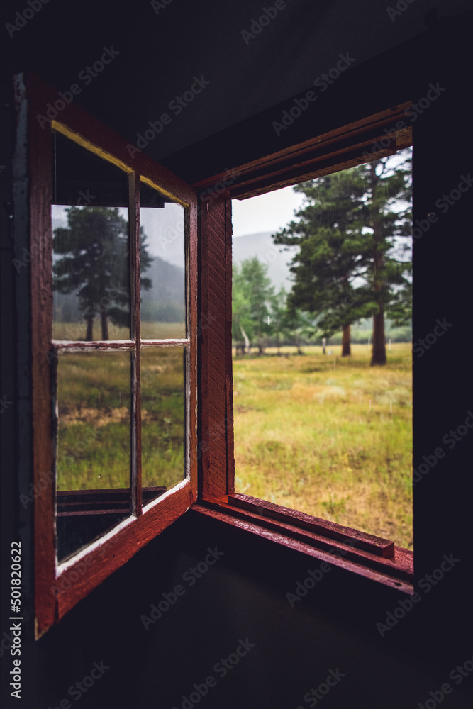 A Window Opens to Look Out on a Rainy Day in the Colorado Mountains A Window Opens to Look Out on a Rainy Day in the Colorado Mountains