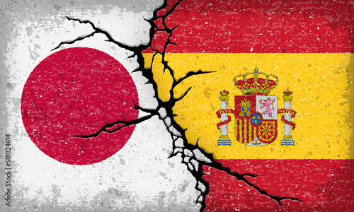 日本とスペイン国旗が割れたコンクリートにペイントされた背景