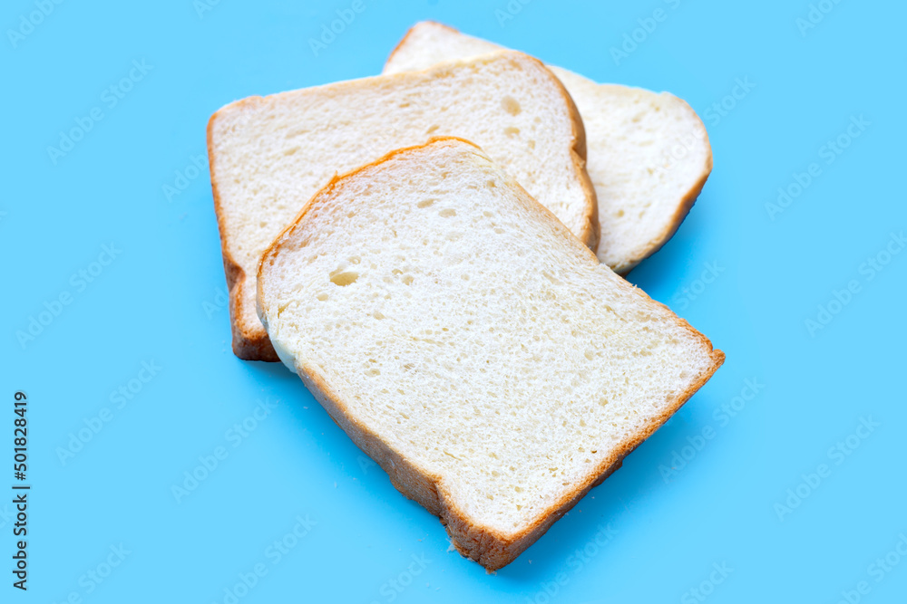 Sliced of bread on blue background. Sliced of bread on blue background.