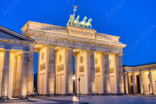 The famous illuminated Brandenburg Gate in Berlin during blue hour