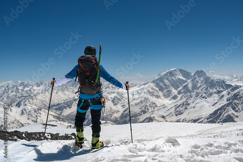 Climber goes to the mountains. winter climbing Elbrus