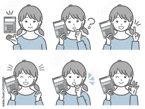 電卓を手に持つ女の子