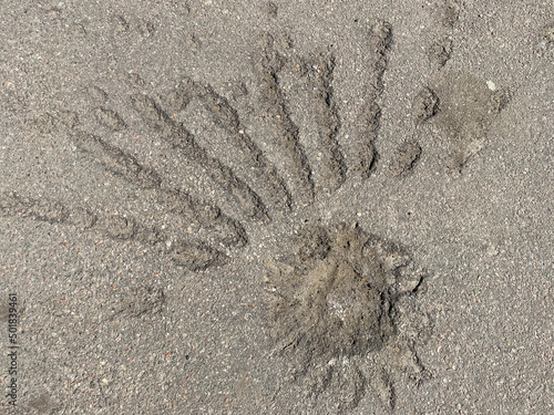 Obraz na plátně track on asphalt caused by cassette bomb explosion