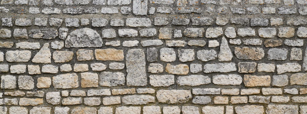 stone textured long made of mesh and stones background wall horizontal facade
