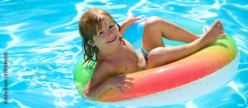 Summer vacation fun. Happy little boy having fun in swimming pool. Banner for header, copy space. Poster for web design. © Volodymyr