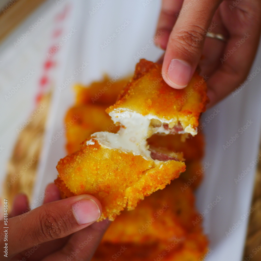 Selective focus risoles sosis mayo (American risoles) or mayonnaise sausage rissole is a small patty rolled in breadcrumbs. it is filled with mayonnaise, boiled egg and sausage. Selective focus risoles sosis mayo (American risoles) or mayonnaise sausage rissole is a small patty rolled in breadcrumbs. it is filled with mayonnaise, boiled egg and sausage.