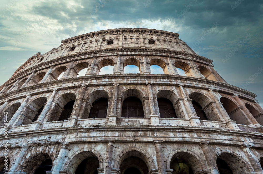 Fototapeta premium Colosseum in Rome (Roma), Italy. The most famous Italian sightseeing on blue sky