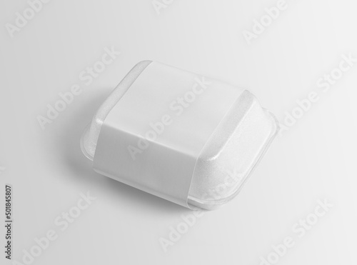 White plain styrofoam food packaging box with empty blank branding label on isolated background