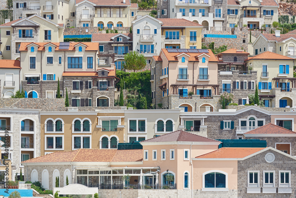City landscape with houses on a mountainside in Lustica Bay, Montenegro