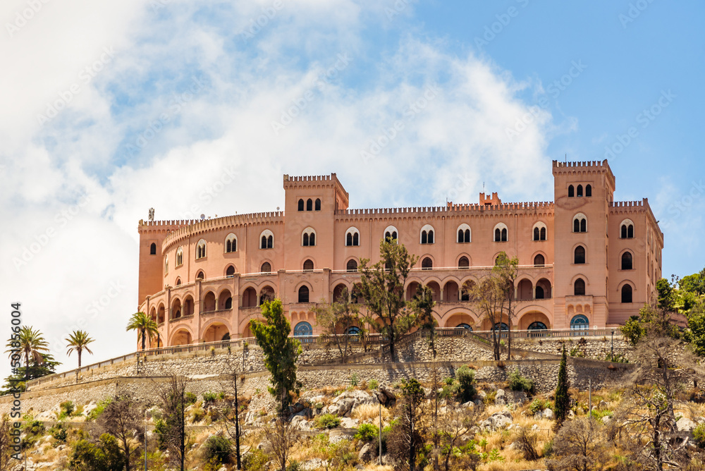View of the Castello Utveggio on the hill of Pellegrino, mount on a clear sunny day. Palermo, Sicily.