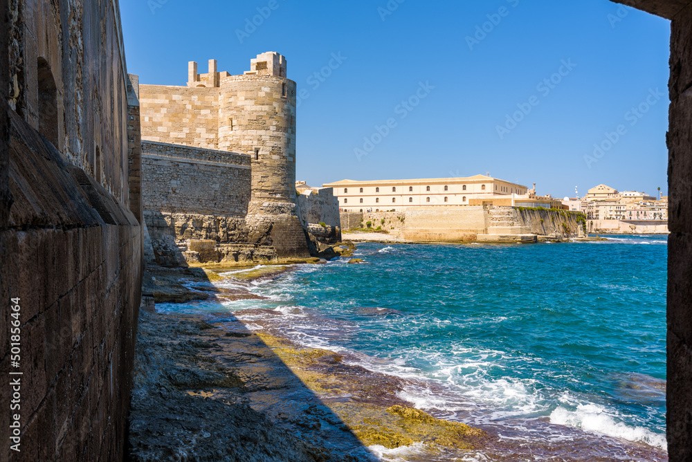 The Maniace Castle in the island of Ortigia. It was built during the Swabian period by Emperor Frederick II of Swabia. It features a decorated portal, arches, towers, a banquet room and a lighthouse.
